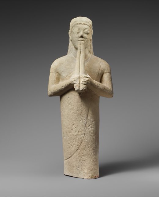 Limestone statuette of a male aulos player